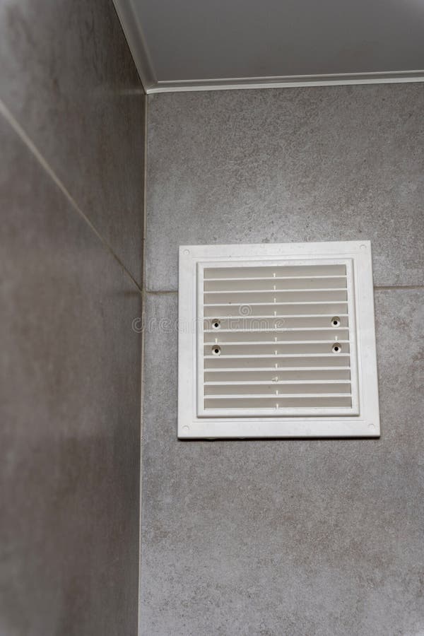 Plastic White Ventilation Grille in the Bathroom. Ventilation Device