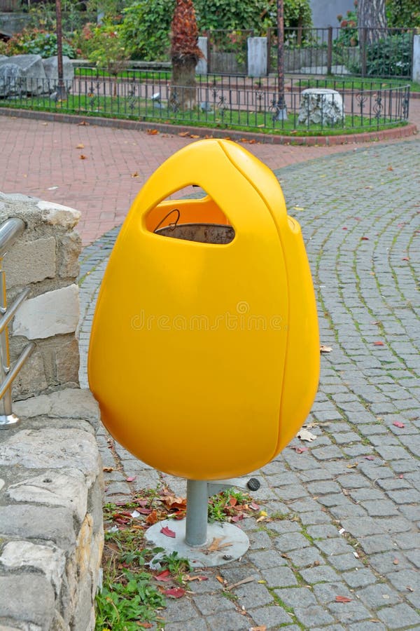 Yellow Plastic Garbage Can in the Park Stock Photo Image of trash