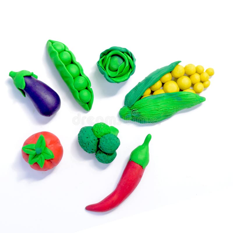 Plasticine vegetables, Corn, tomato, peas, eggplant, broccoli, cabbage, cayenne pepper, isolated on white background