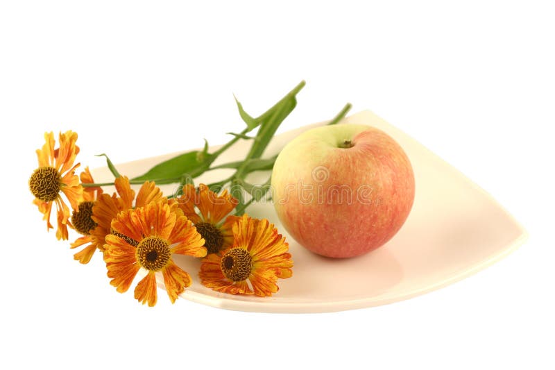 Plate with apple and a flower