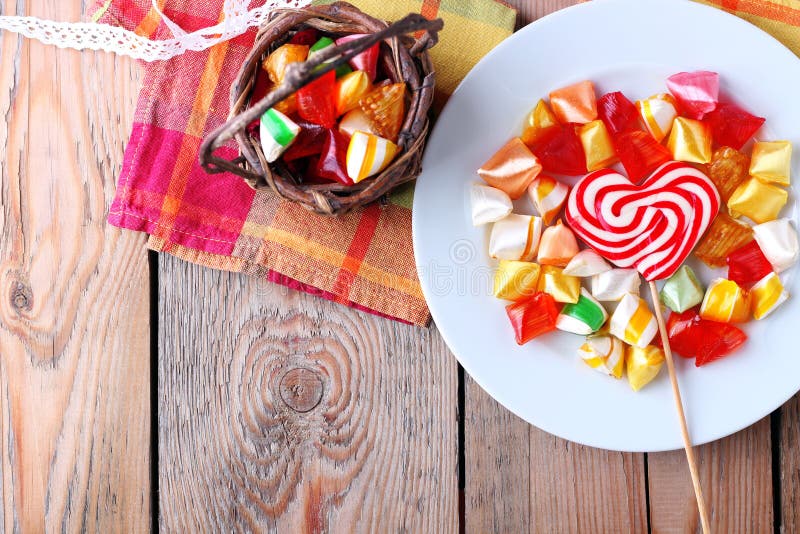 Plate and basket with colorful sweet candies