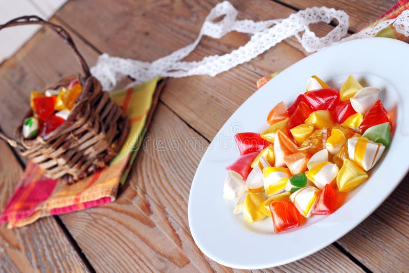 Plate and basket with colorful sweet candies