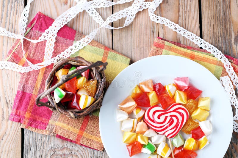 Plate and basket with colorful sweet candies