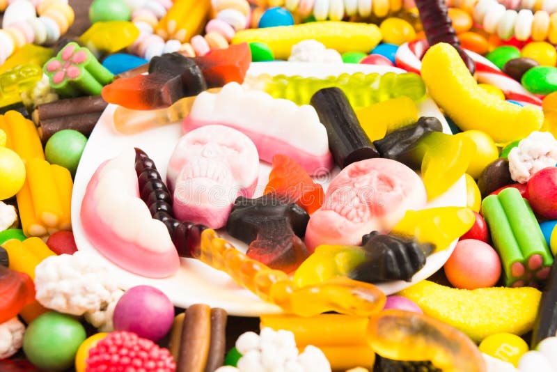 Plate with candies for halloween and many other candies stock photography Plate with candies for halloween and many other candies stock photography