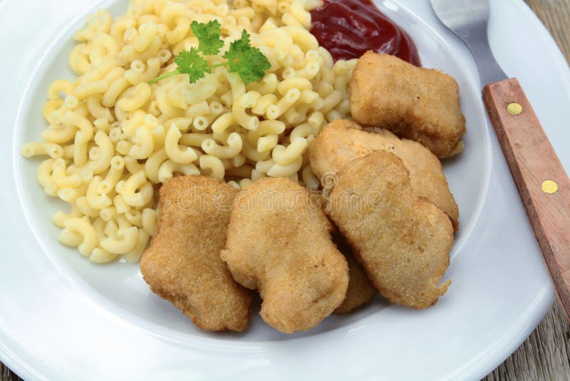 Plate of Chicken Nuggets and Pasta Stock Image - Image of fried ...