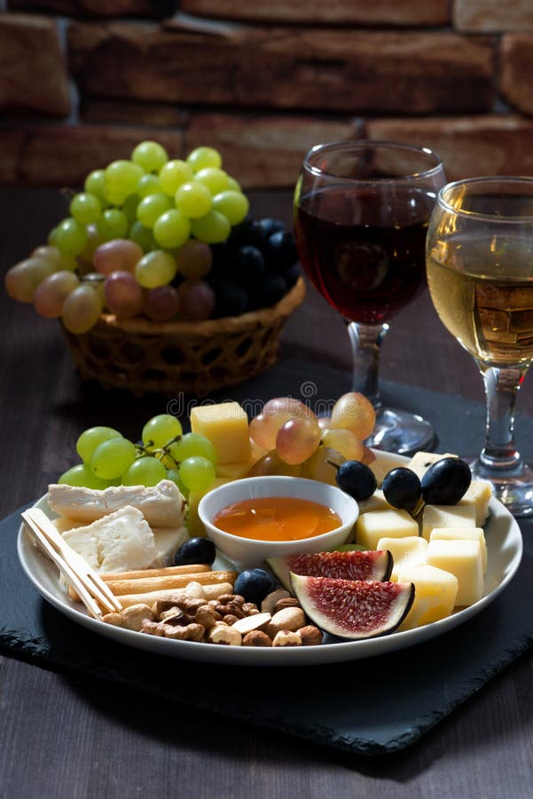 Plate with Snacks, Sausage, Cheese, Nuts and Fruit Stock Image Image