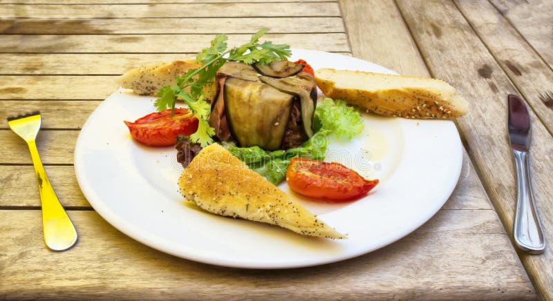 Plate with delicious food on wooden table stock photos
