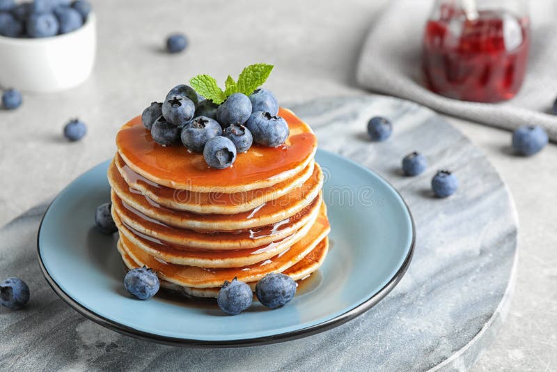 Plate of delicious pancakes with fresh blueberries and syrup royalty free stock images Plate of delicious pancakes with fresh blueberries and syrup royalty free stock images