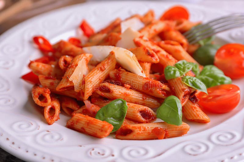 Plate with Delicious Penne Pasta and Garnish, Closeup Stock Image