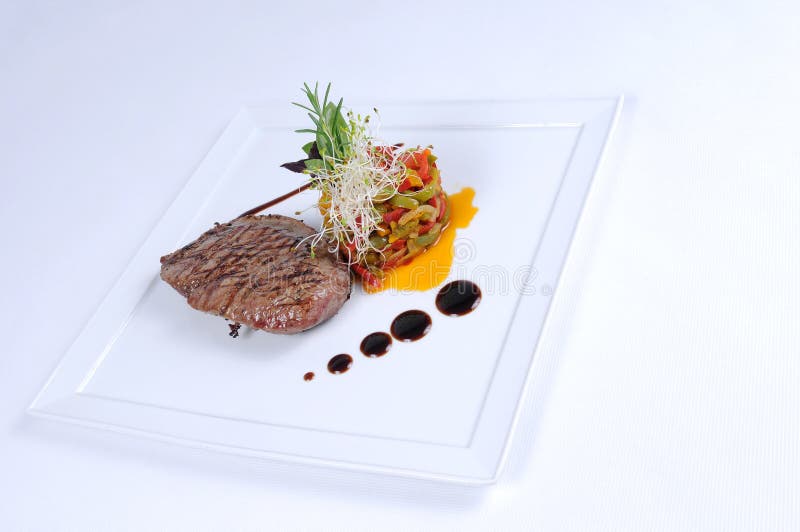 Plate of fine dining meal ostrich fillet salad