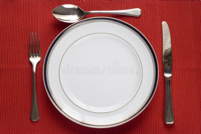 Plate, fork, knife and spoon stock photos