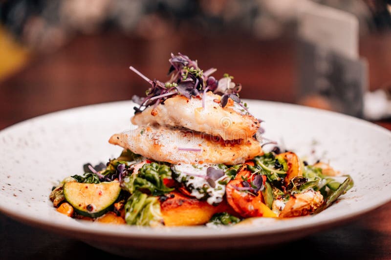 Plate of Freshly Prepared Food Displayed on a Restaurant Table Stock