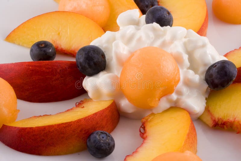 Plate of fruit and cottage cheese stock photography
