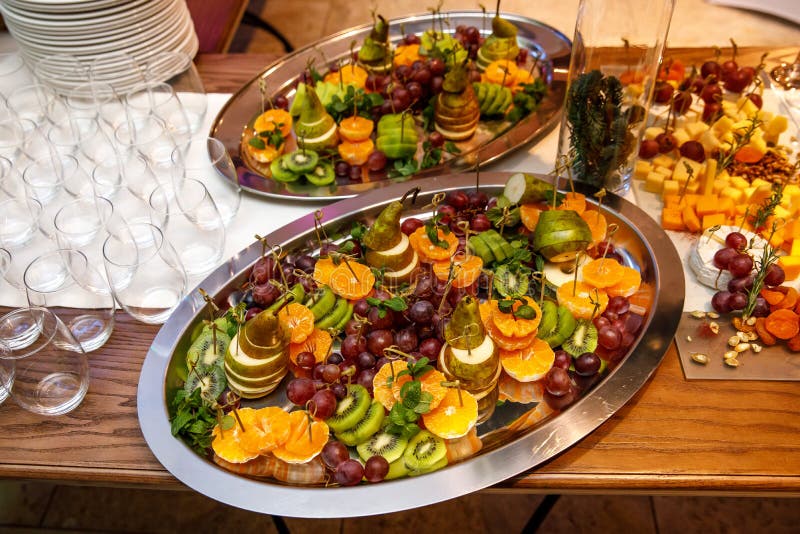 Plate with fruits and berries on table, event catering. stock images