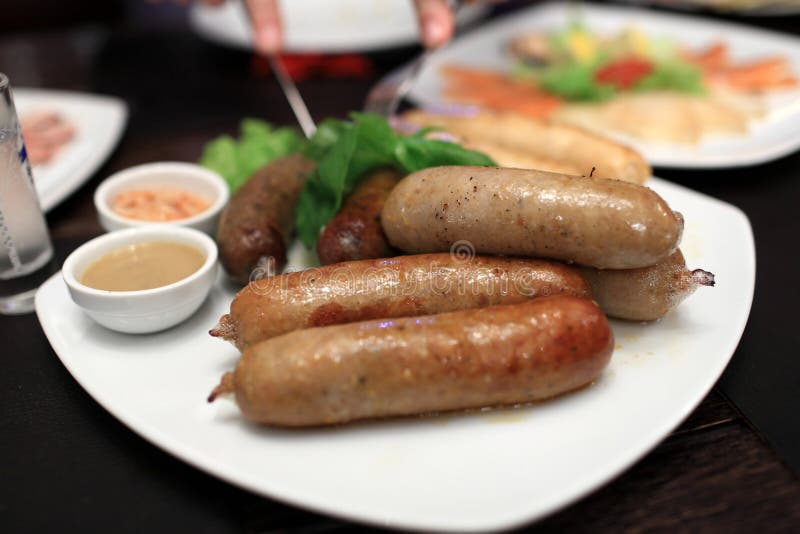 Plate of grilled sausages stock image.