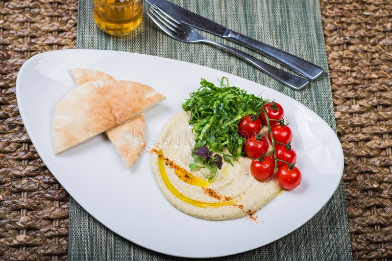 Plate with Hummus Dip and Tapas Stock Image Image of finger, eating 34825953