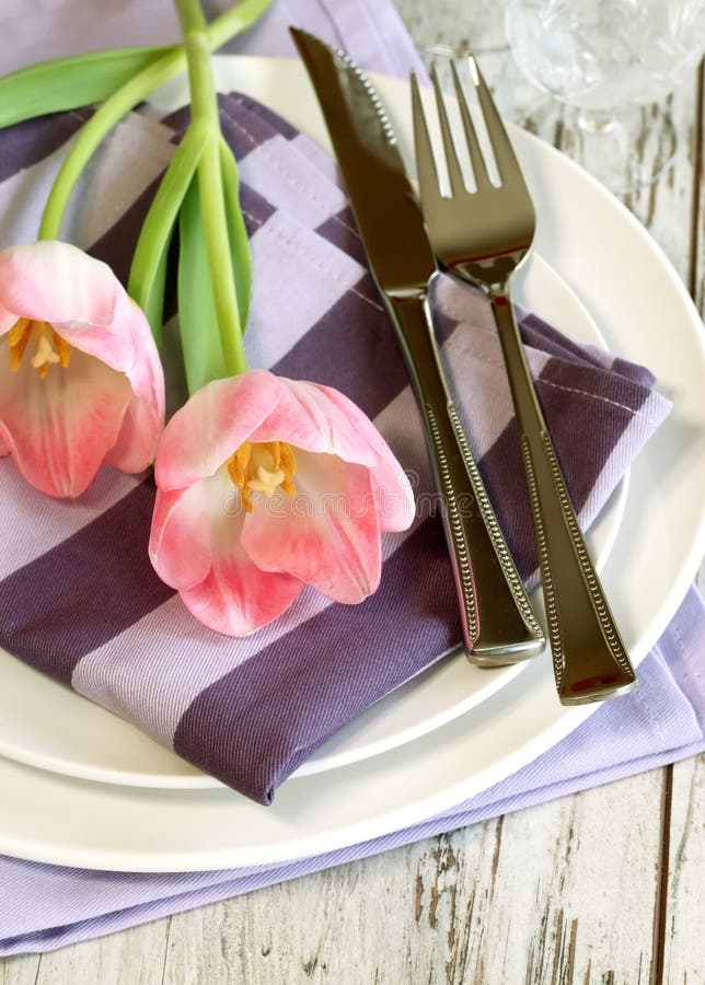 Plate, knife, fork and tulips