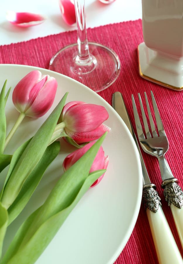 Plate, knife, fork and tulips