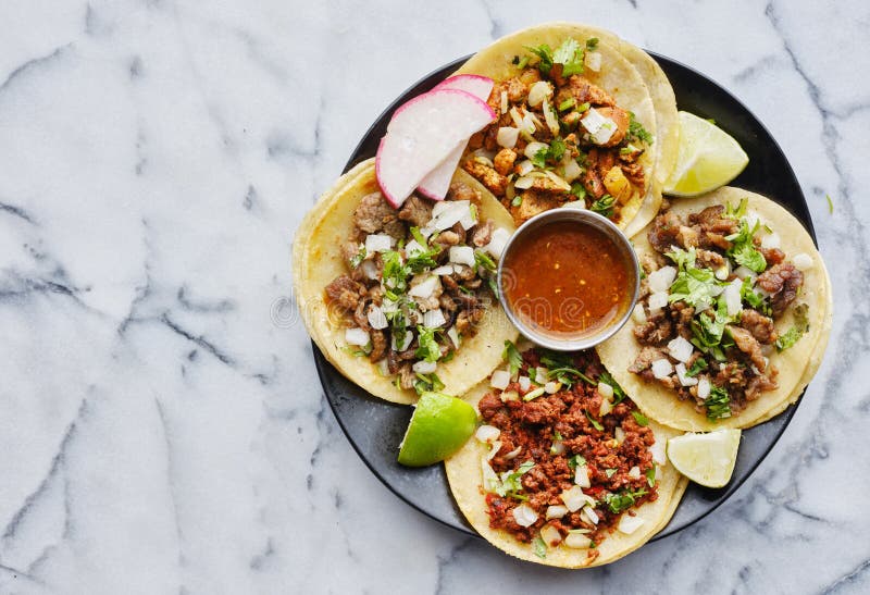 Plate of mexican street tacos in copy space composition