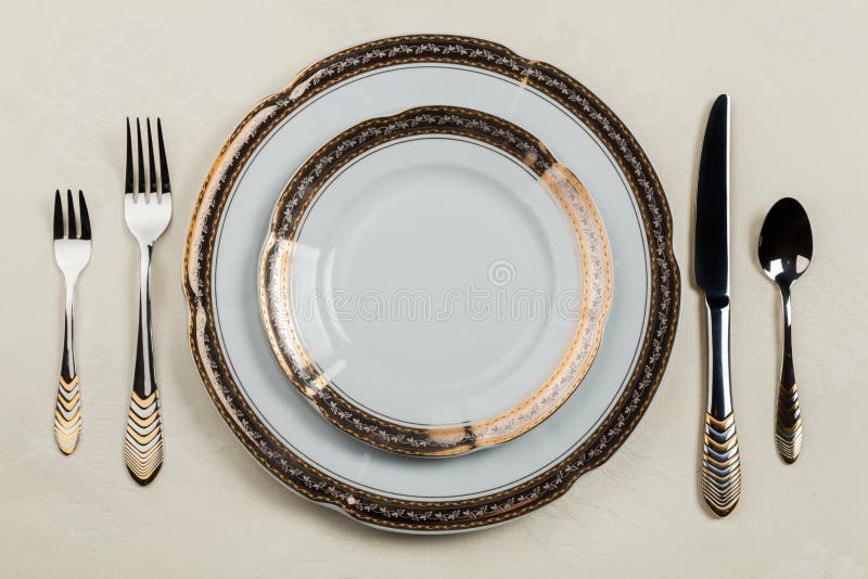 Table Setting with Plate, Forks, Knife and Spoon Stock Image - Image of ...