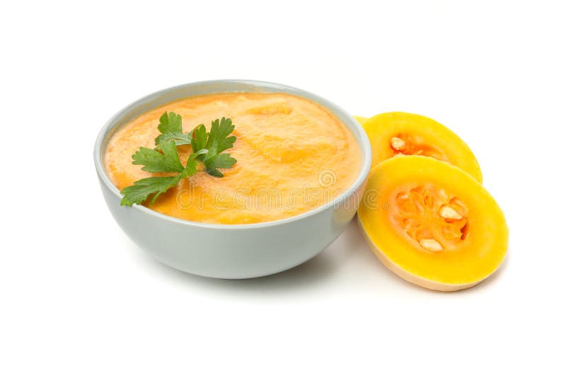 Plate of pumpkin puree and butternut slices isolated on white royalty free stock image