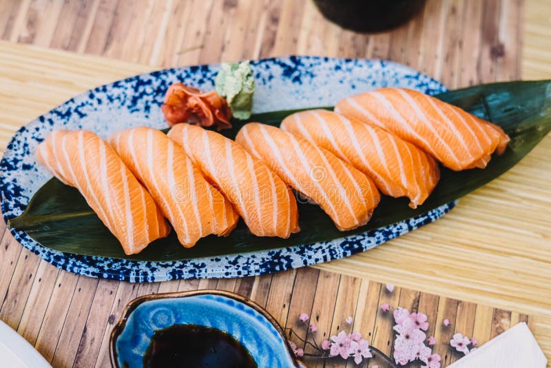 Plate of Salmon Niguiri with Soy Sauce in a Sushi Restaurant Stock Photo -  Image of delicacy, food: 220802524
