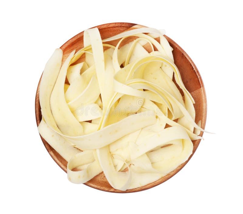 Plate with sliced fresh parsnip on white background, top view royalty free stock image