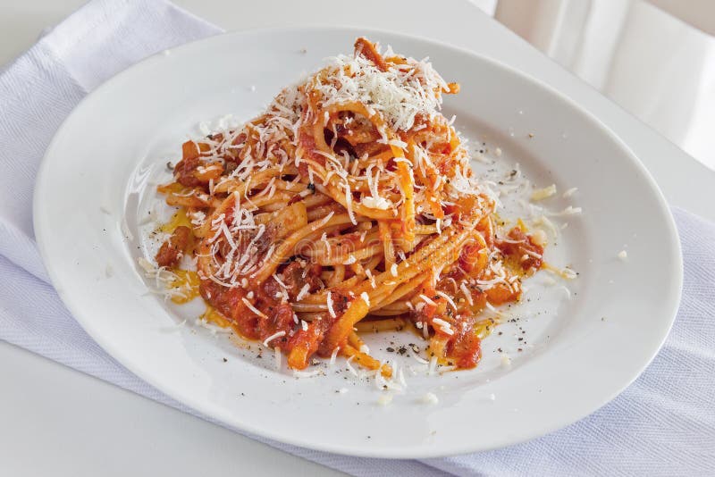 Plate of Spaghetti with Tomato and Bacon and Pecorino Cheese Stock