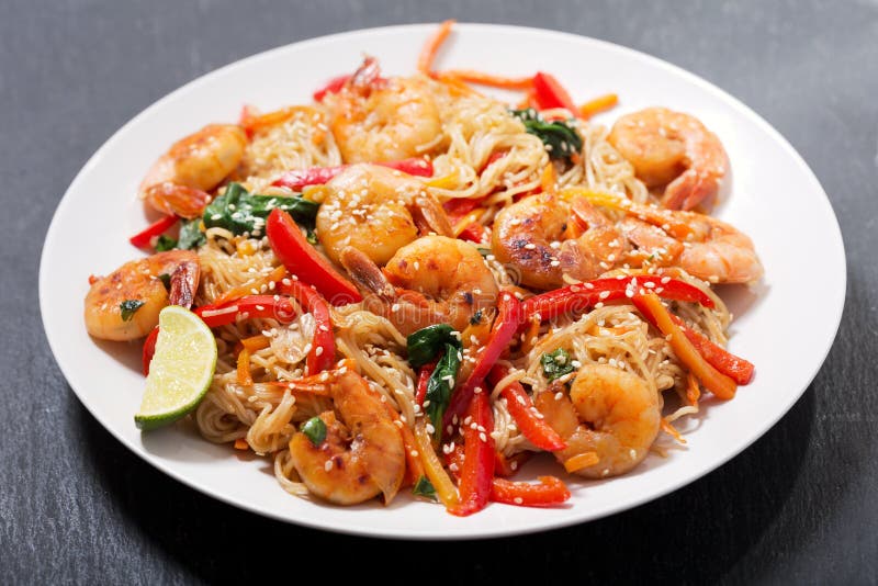 Plate of Stir fried noodles with shrimps and vegetables
