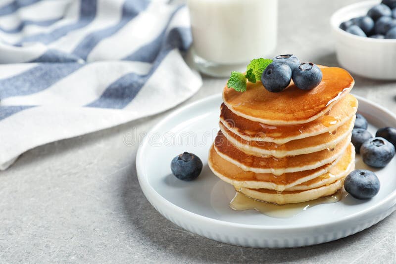 Plate of Tasty Pancakes with Blueberries and Honey on Table Stock Photo ...