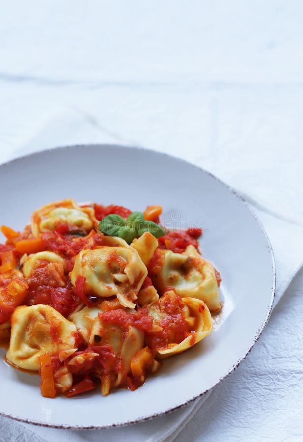 A Plate of Tortellini Pasta with Tomato Sauce Stock Image Image of