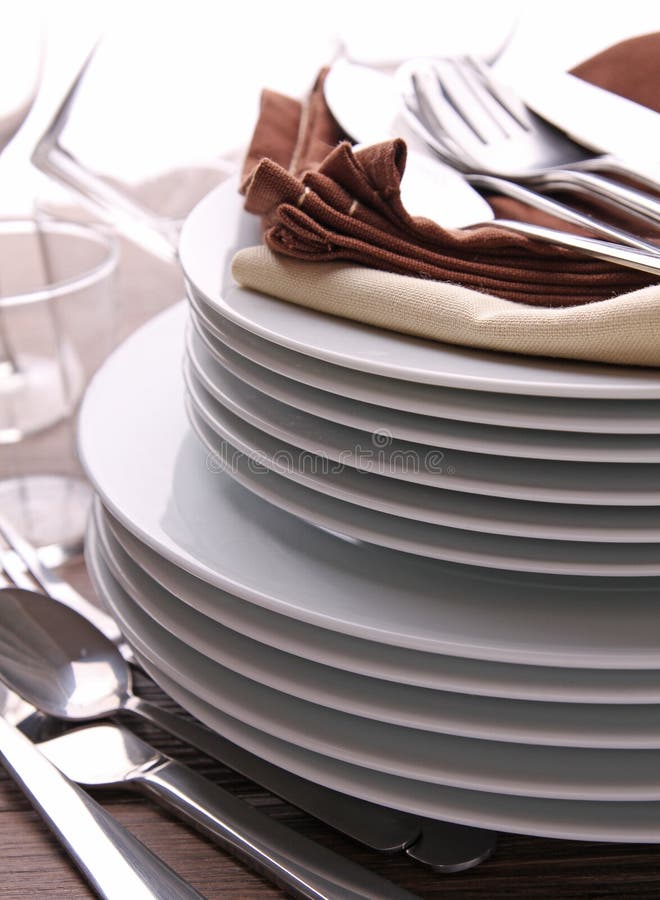 Plates stack an cutlery stock photo. Image of pile, porcelain 21032410