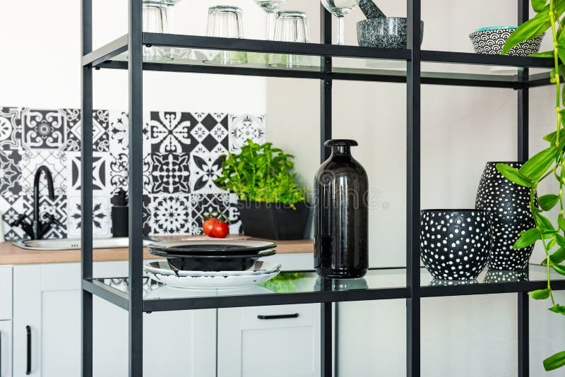 Plates, Vases and Pots on Metal Shelf in White Scandinavian Kitchen