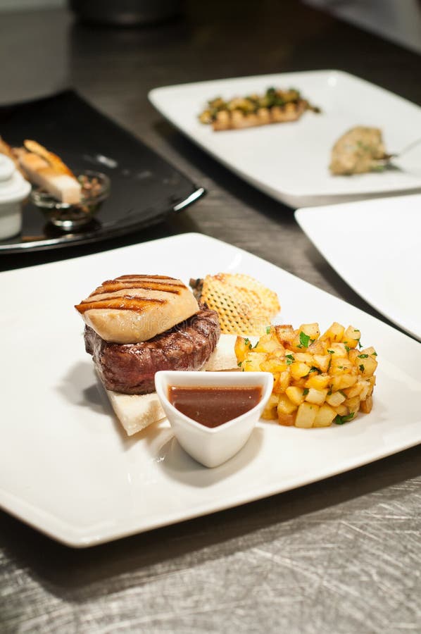 Plating a foie gras dish stock image. Image of meat, dish 26698075