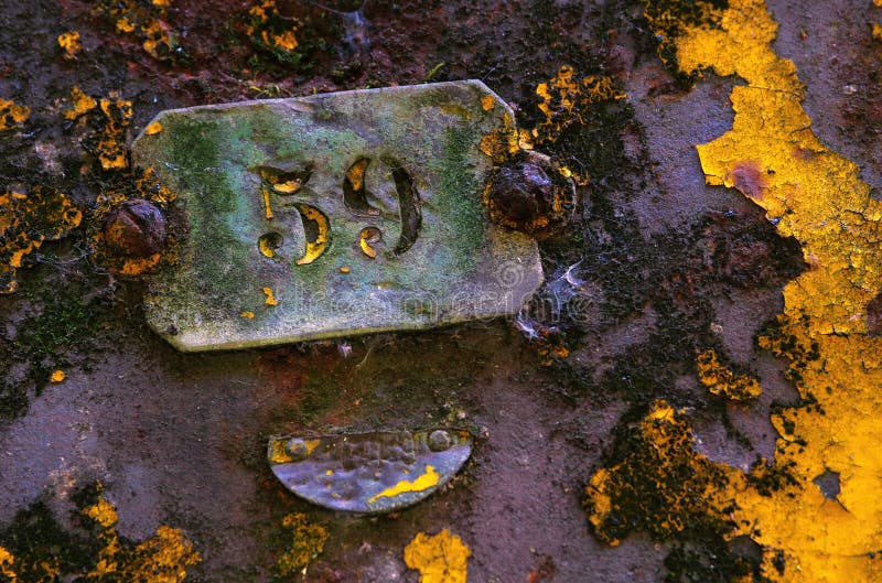 Rusty surface of an old industrial machine with a plate with the number 59. Rusty surface of an old industrial machine with a plate with the number 59