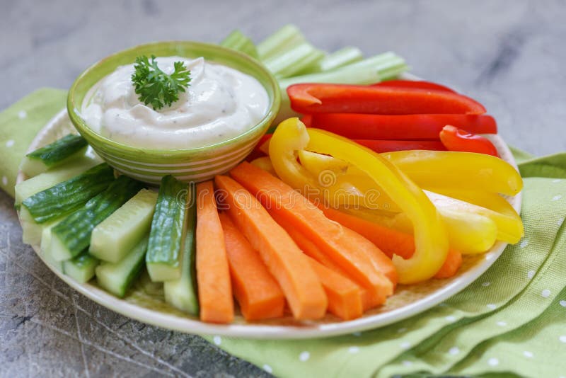 Platter of assorted fresh vegetables with dip