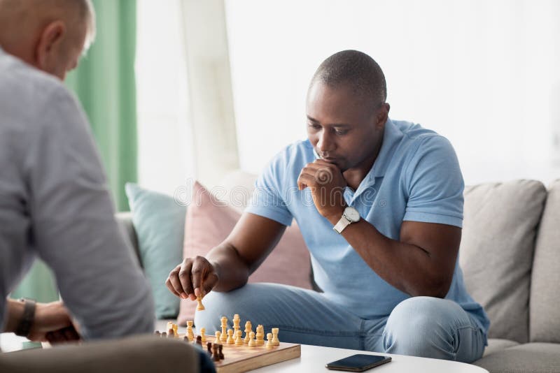 friends playing chess, Stock image