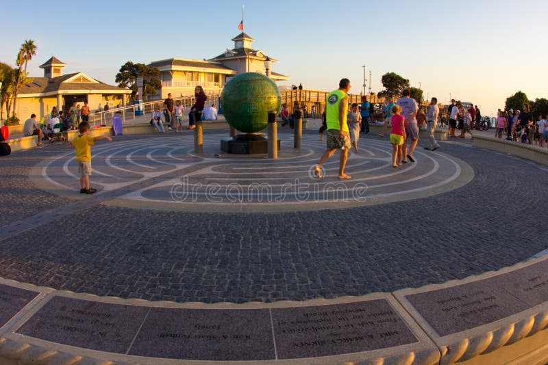 NEWPORT BEACH, CA - AUG 9: Sunset at Newport Beach, Ca pier on Aug. 9, 2012. Incorporated in 1906 Newport Beach is considered one of Ocean County's meccas. NEWPORT BEACH, CA - AUG 9: Sunset at Newport Beach, Ca pier on Aug. 9, 2012. Incorporated in 1906 Newport Beach is considered one of Ocean County's meccas.