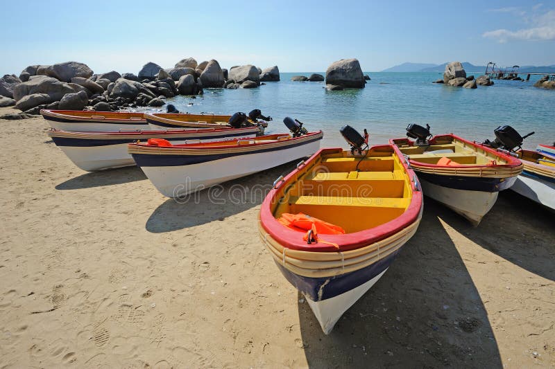 Beach with boats in Sanya,Hainan,China. Beach with boats in Sanya,Hainan,China.