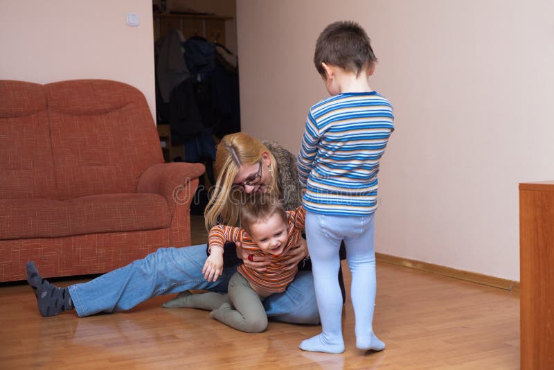 Playful children and woman laughing royalty free stock photos Playful children and woman laughing royalty free stock photos