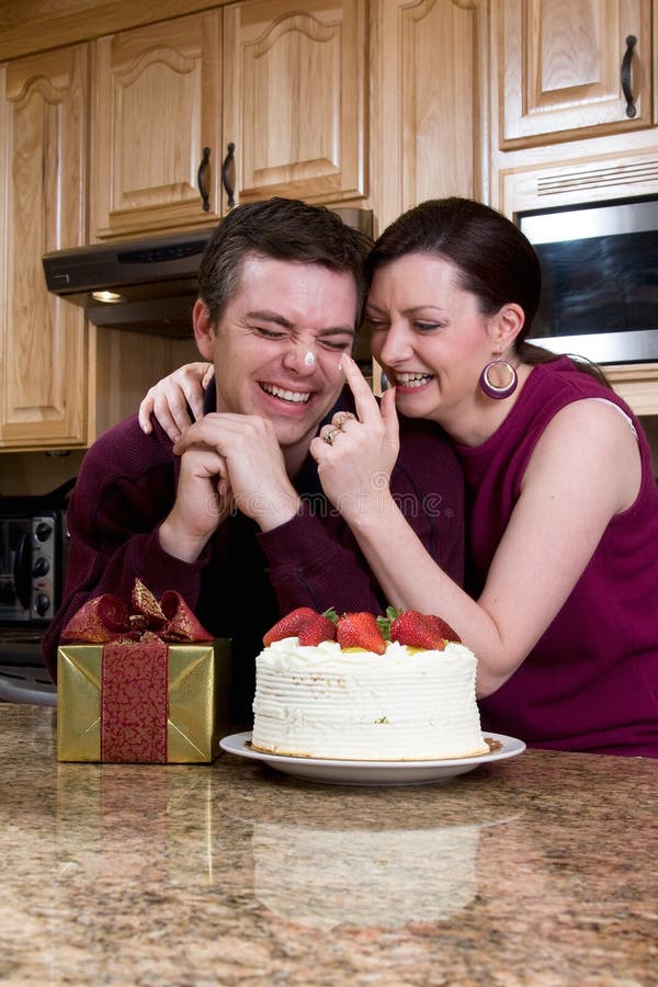 Playful Couple in the Kitchen - Vertical