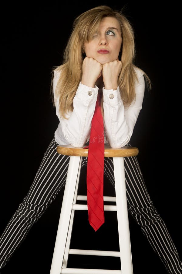 Playful expression female leaning on her bar stool