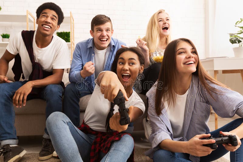 Multiethnic group of people playing online video games on tv