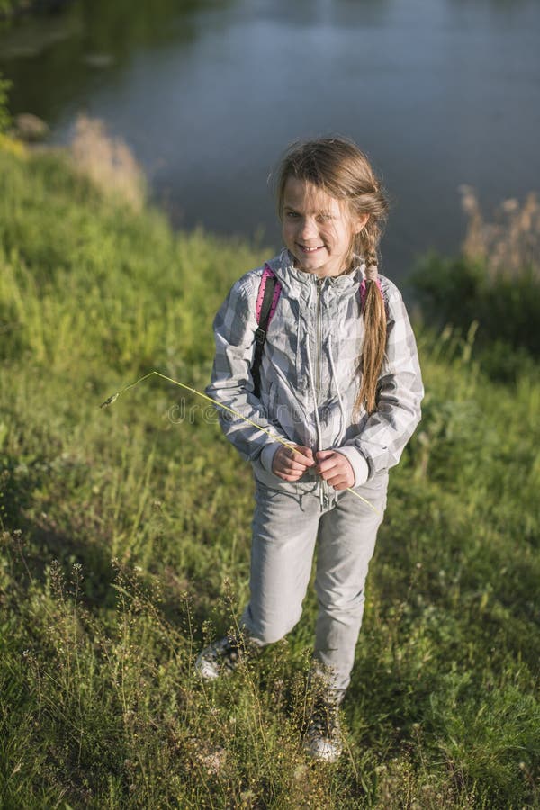 Playful girl near river royalty free stock photos Playful girl near river royalty free stock photos