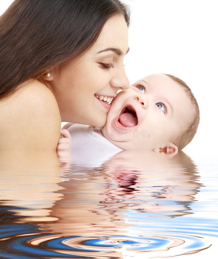 Playful mama with happy baby in water royalty free stock photos Playful mama with happy baby in water royalty free stock photos