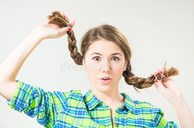 Playful teen with long pigtails