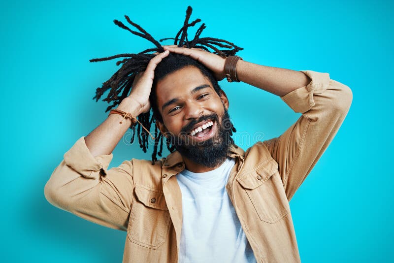 Playful young African man in casual clothing