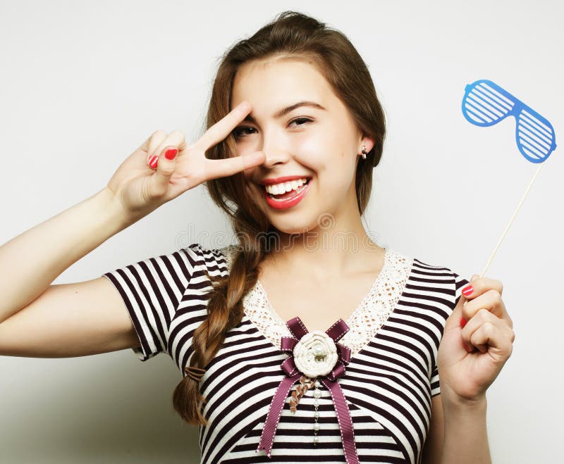 Playful young women holding a party glasses. royalty free stock images