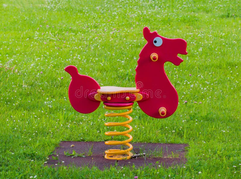 Playground Spring Horse in a Meadow Full of White Flowers Stock Photo