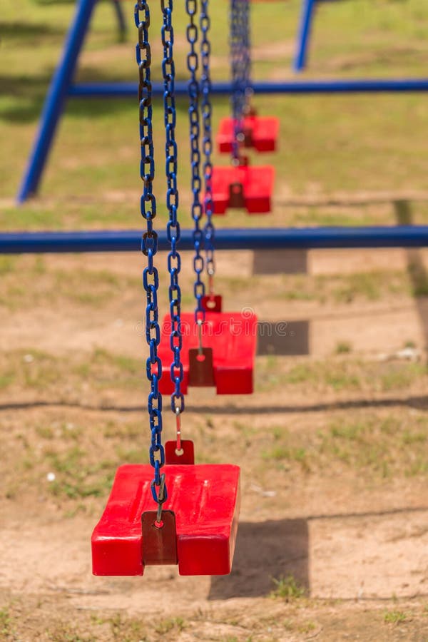 Playground swing in a park stock photo. Image of iron 64064680